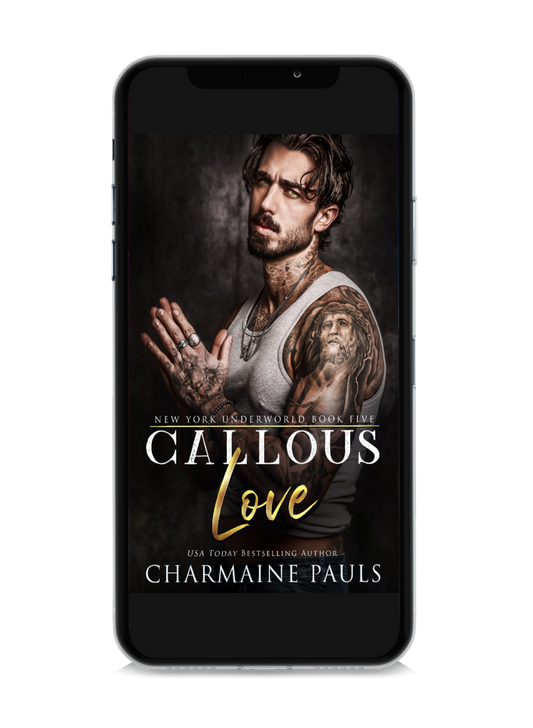 A cell phone displaying the book cover of 'Callous Love' by Charmaine Pauls.